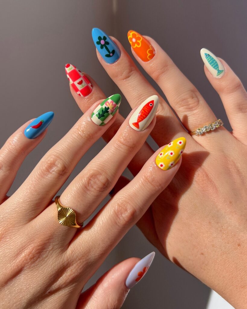 Capri inspired manicure with fish and flowers in a playful motif