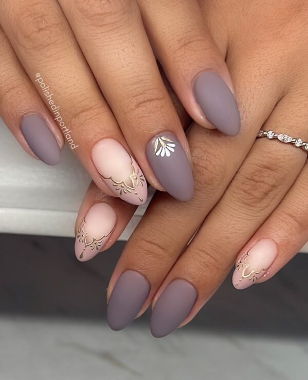 mauve matte almond nails with gold accents