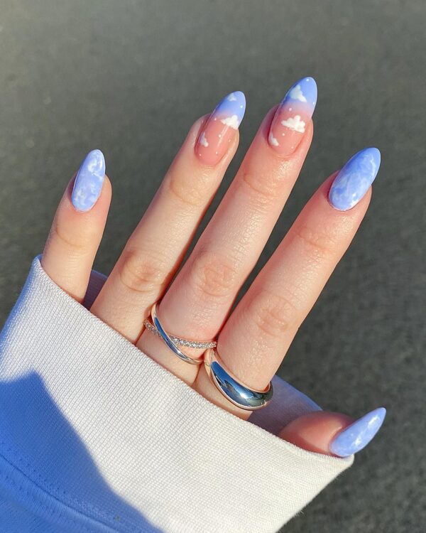 Periwinkle blue nails with clouds and marble effect for spring 2025
