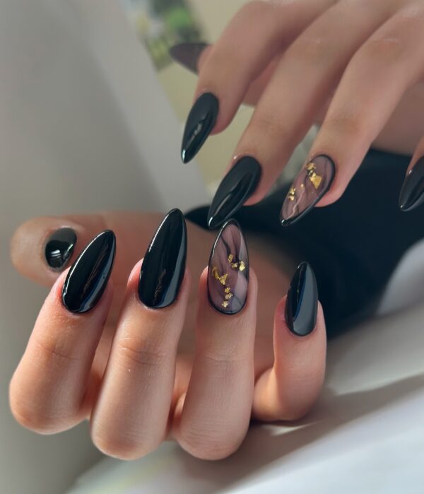 Moody black and marble Halloween nails on long almond tips