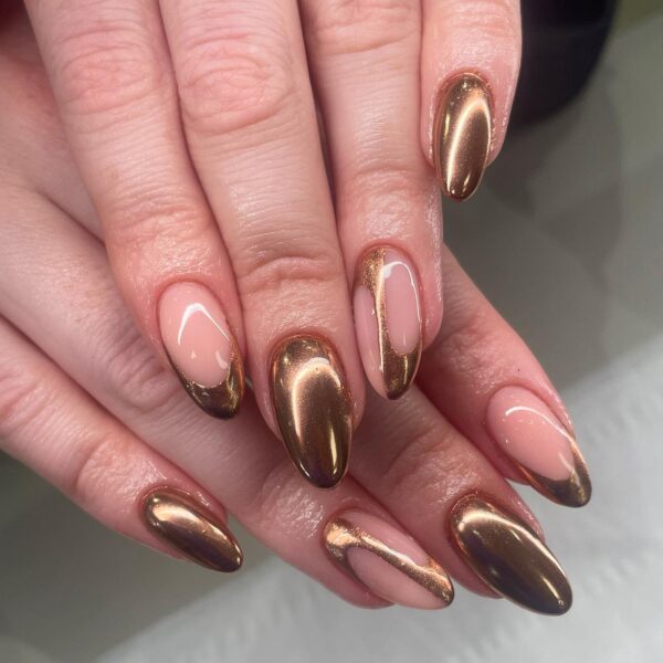 Bronze chrome nails on almond tips for the fall season