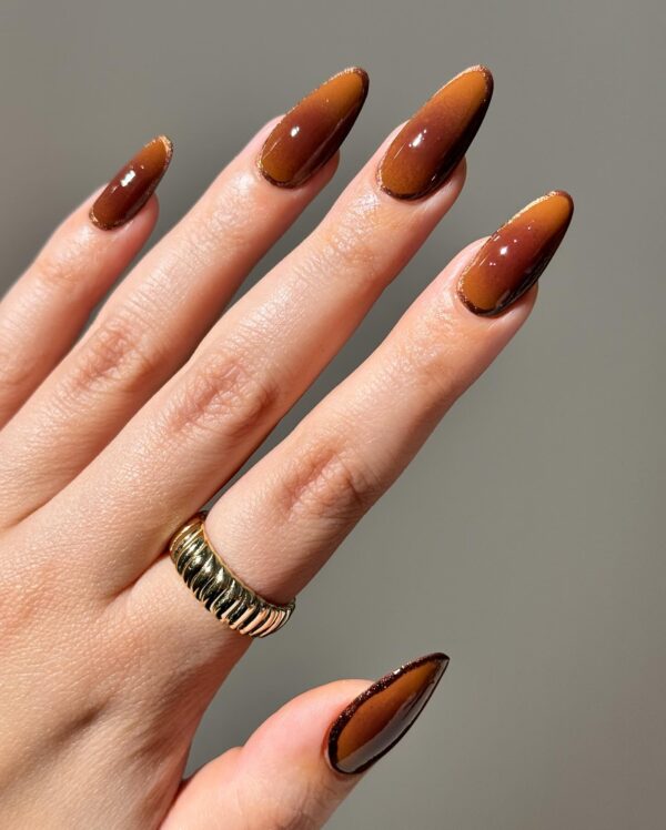 Shimmering chocolate caramel almond nails for fall nail trends in 2025