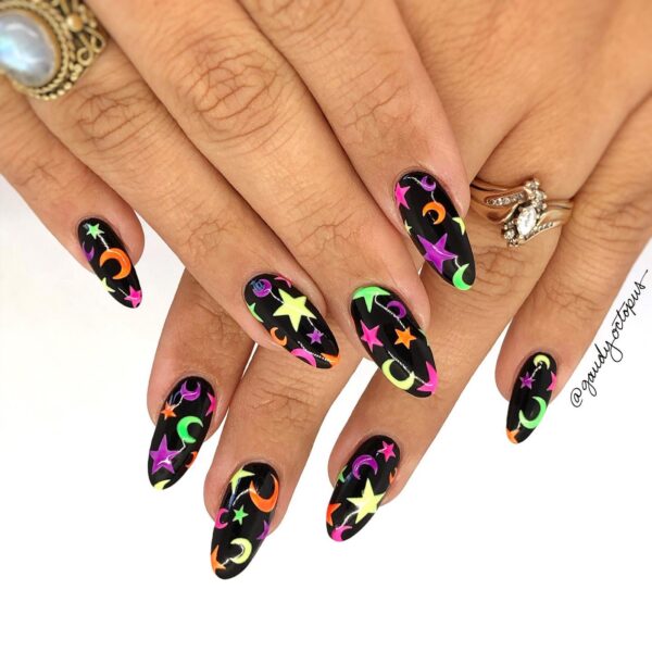Neon halloween nails with stars and moons on a black base