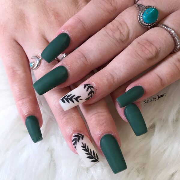 Matte forest green nails with leaf accent nails for fall