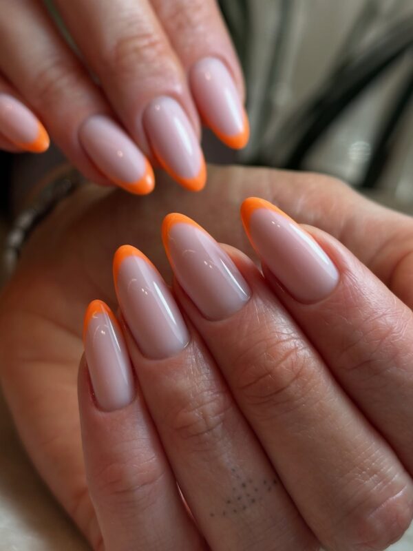 Trendy french tip nails in orange for Halloween