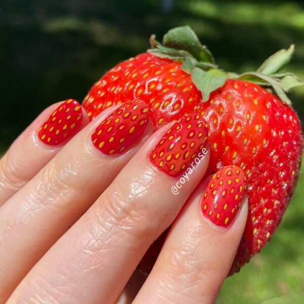 Medium strawberry nails in a realistic strawberry texture